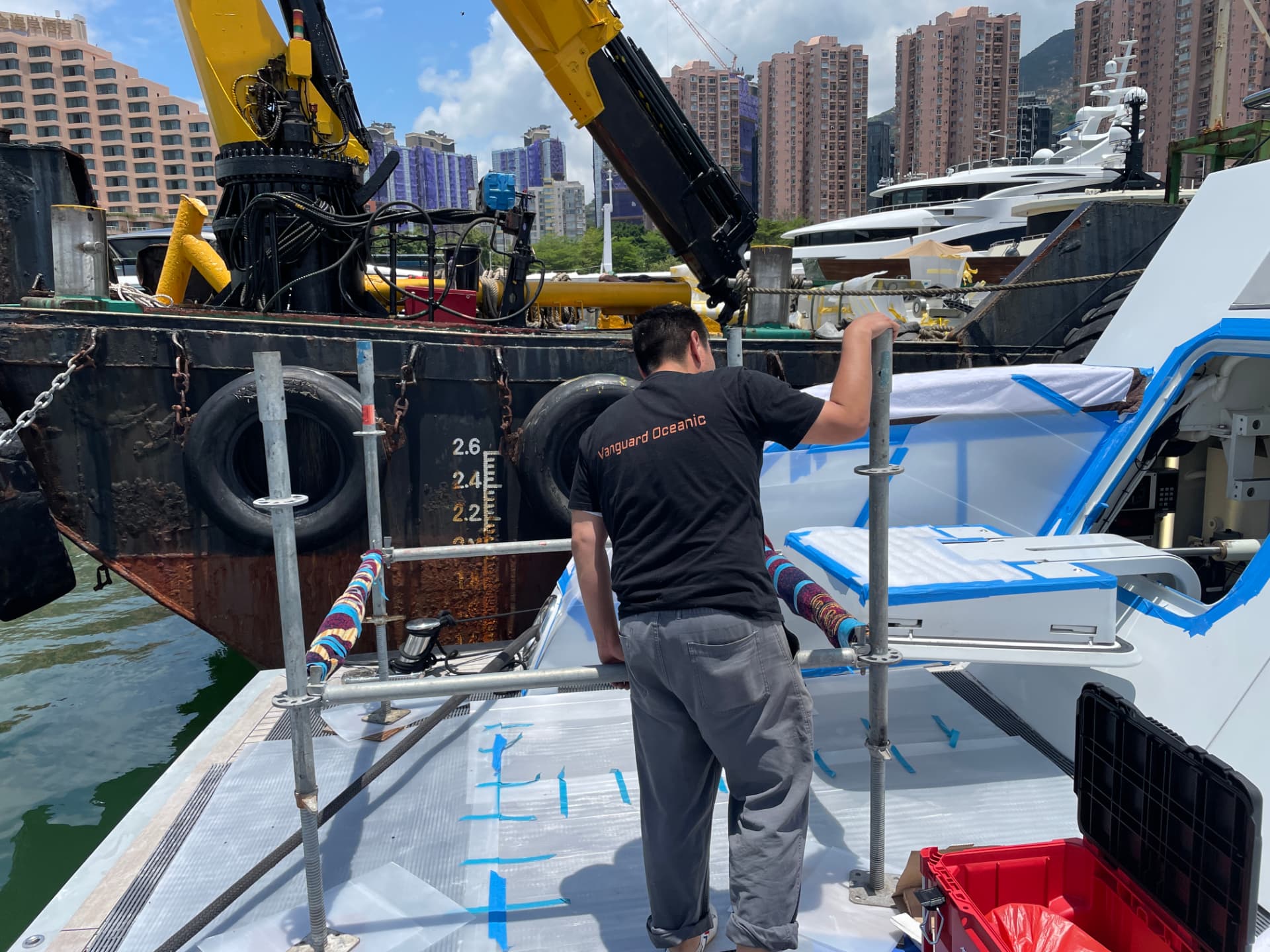 VO Marine technician installing a hydraulic passarelle dockside in Hong Kong