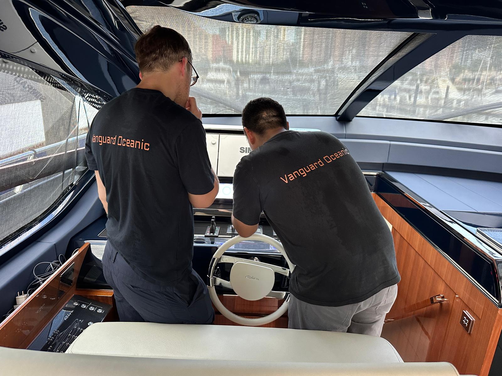 VO Marine technicians commissioning helm electronics on a motor yacht