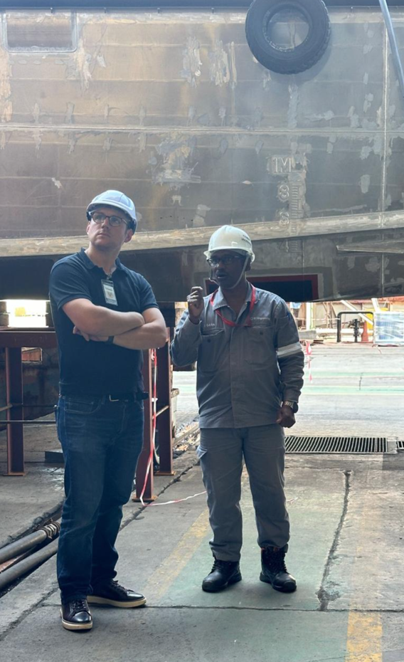 Vanguard Oceanic engineer reviewing technical work at a shipyard